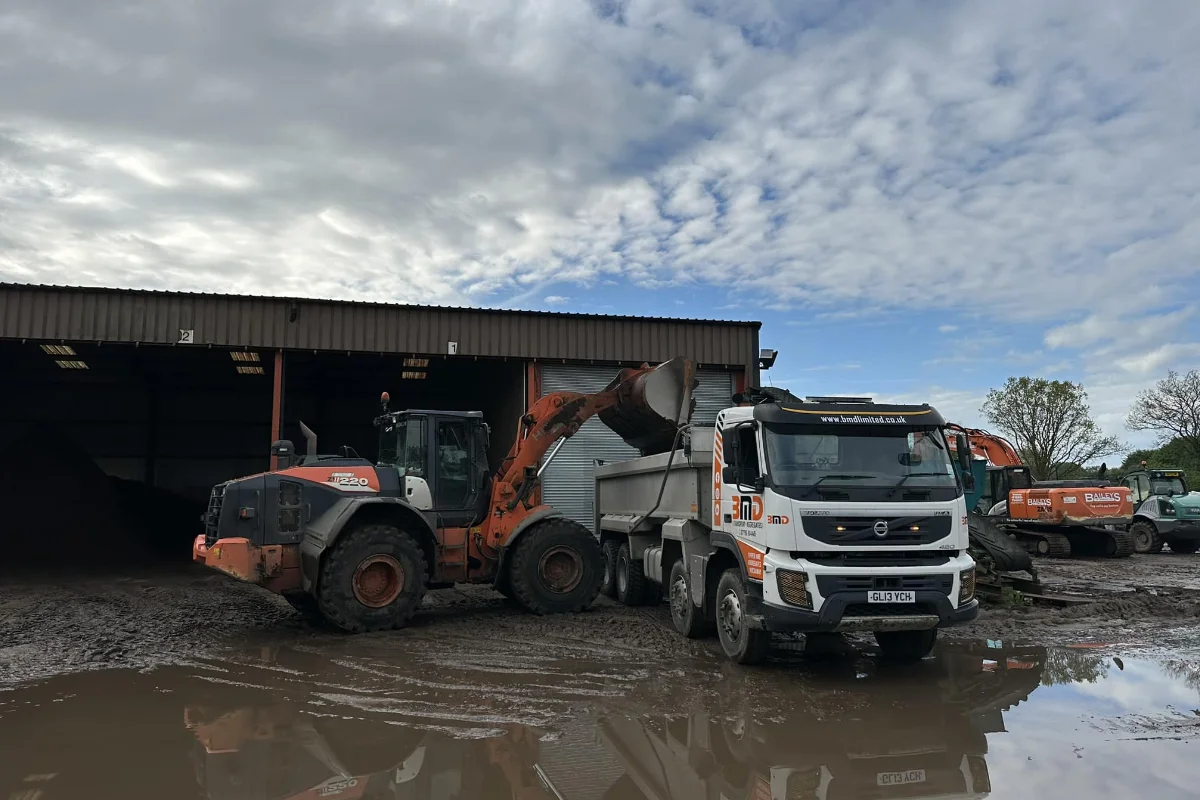 BMD tipper lorry being loaded by a wheel loader at a Norfolk yard